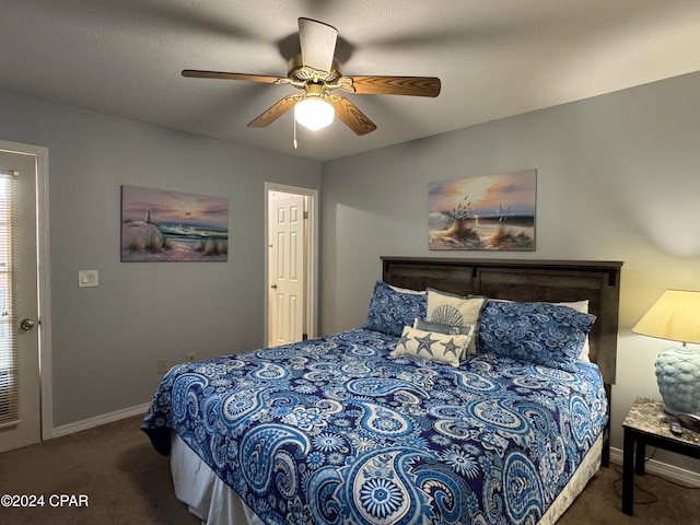 bedroom with dark carpet and ceiling fan