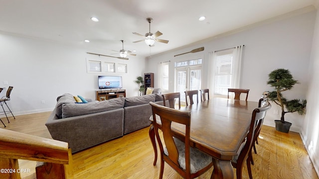 dining area featuring ornamental molding, light hardwood / wood-style flooring, and ceiling fan