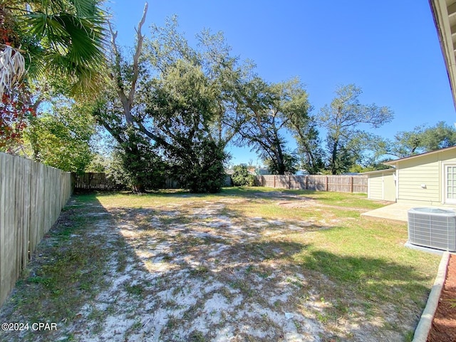 view of yard featuring central AC and a patio area