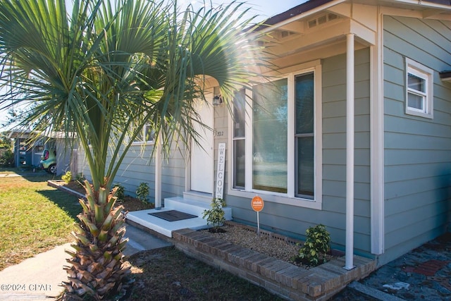 view of side of property featuring entry steps