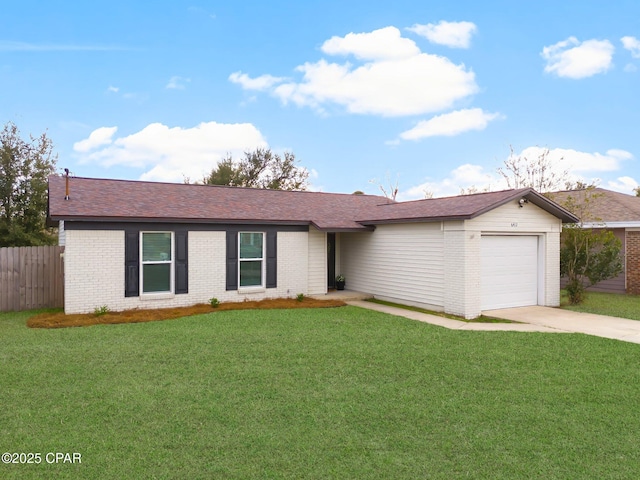 ranch-style house featuring a garage and a front yard