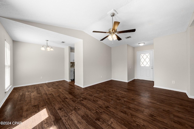 interior space featuring dark hardwood / wood-style flooring, ceiling fan with notable chandelier, and lofted ceiling