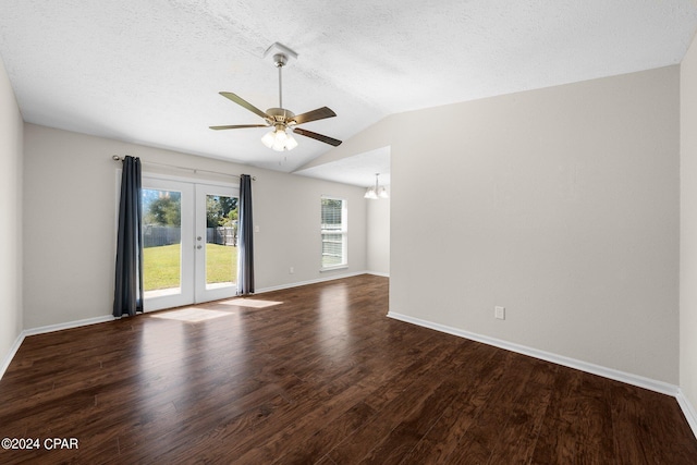 unfurnished room featuring vaulted ceiling, a textured ceiling, dark hardwood / wood-style floors, ceiling fan, and french doors