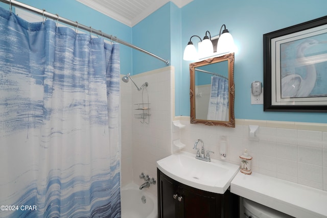 bathroom featuring shower / bathtub combination with curtain, vanity, ornamental molding, and tile walls