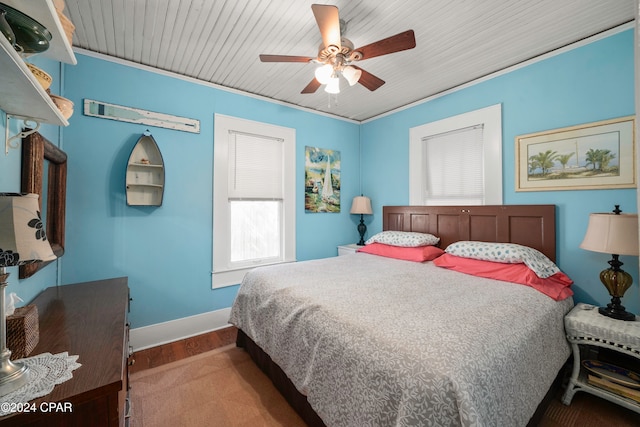 bedroom with hardwood / wood-style floors, ceiling fan, crown molding, and wood ceiling