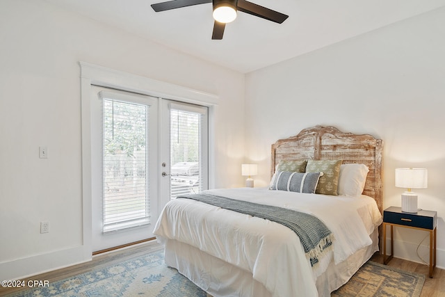 bedroom featuring access to exterior, hardwood / wood-style flooring, and ceiling fan