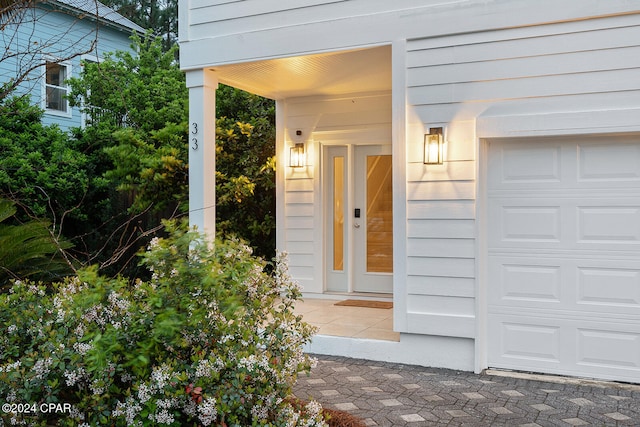 property entrance with a garage