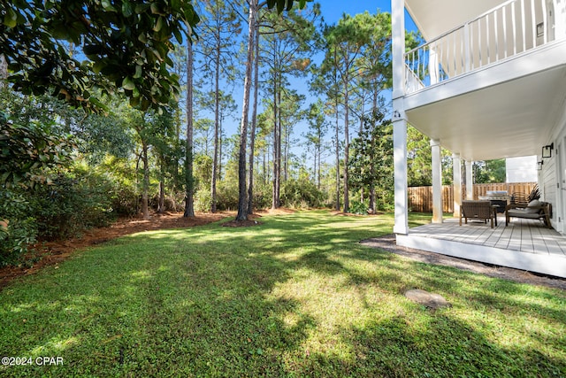 view of yard with a wooden deck