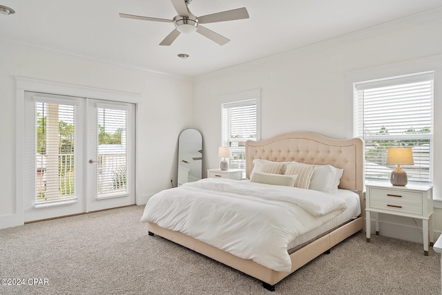 bedroom featuring ceiling fan, multiple windows, carpet, and access to outside