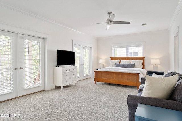 bedroom featuring light carpet, ornamental molding, ceiling fan, french doors, and access to outside