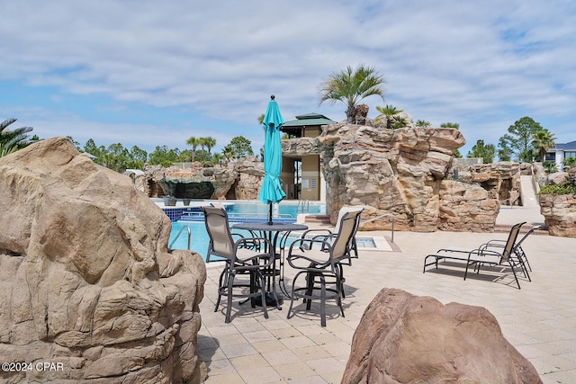 view of patio with a community pool