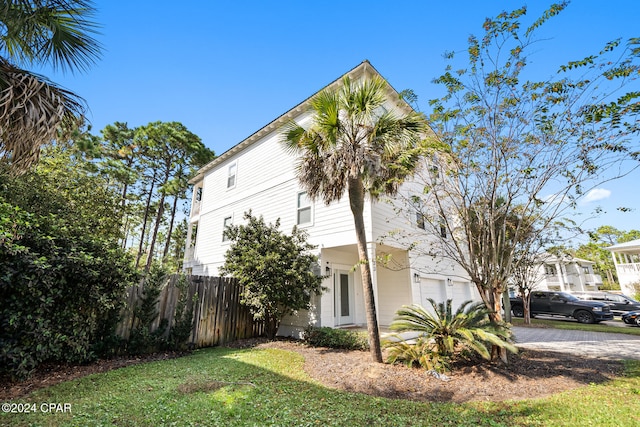 view of side of home featuring a garage