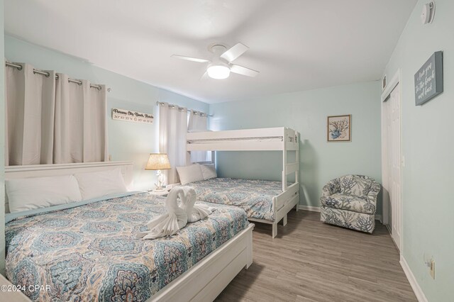 bedroom featuring ceiling fan and light hardwood / wood-style floors