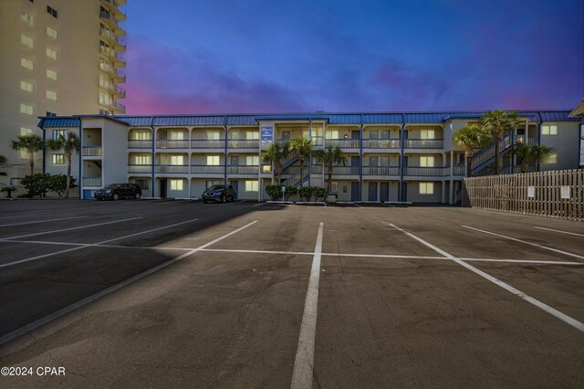 view of parking at dusk