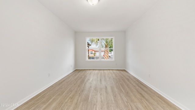 empty room with light hardwood / wood-style floors