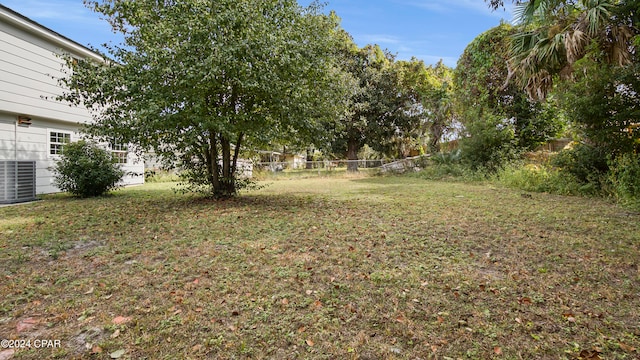 view of yard with central air condition unit