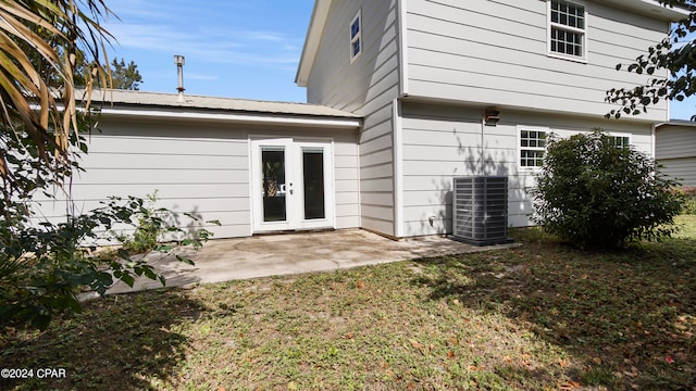 rear view of property with a yard and a patio area