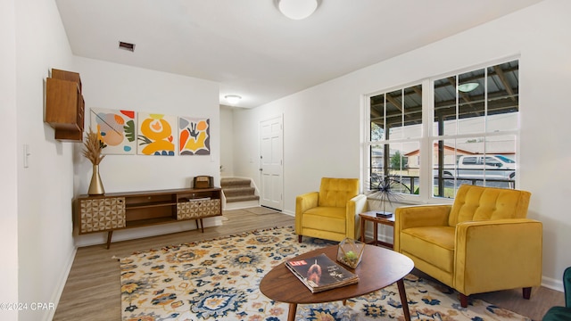 living area with hardwood / wood-style floors