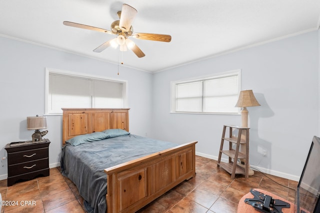 bedroom with ceiling fan, crown molding, and dark tile patterned flooring