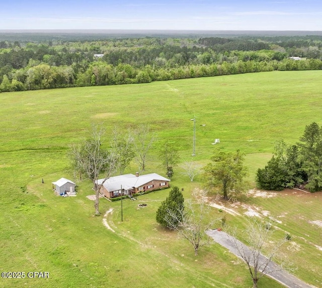aerial view with a rural view and a wooded view