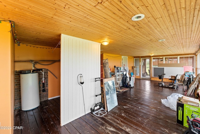 interior space with wood-type flooring, gas water heater, and wood ceiling