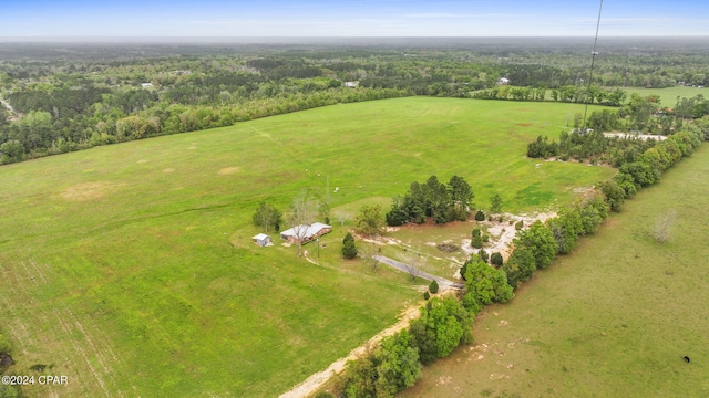 aerial view with a wooded view and a rural view
