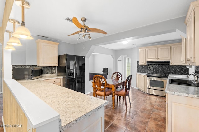 kitchen with a sink, stainless steel appliances, under cabinet range hood, ceiling fan, and light brown cabinetry
