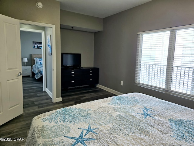 bedroom featuring dark wood-type flooring