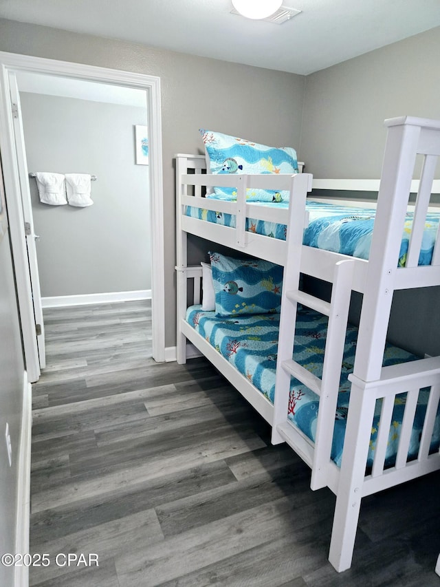 bedroom with hardwood / wood-style floors