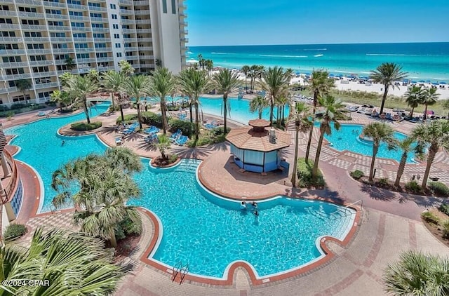 view of pool featuring a water view