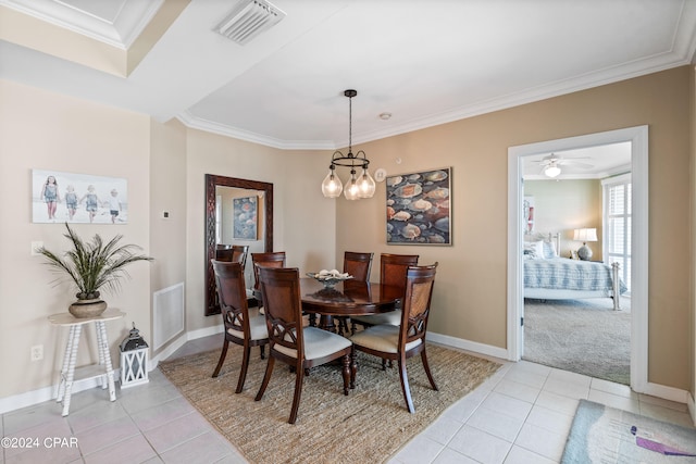 dining area with ceiling fan with notable chandelier, light tile patterned floors, and ornamental molding