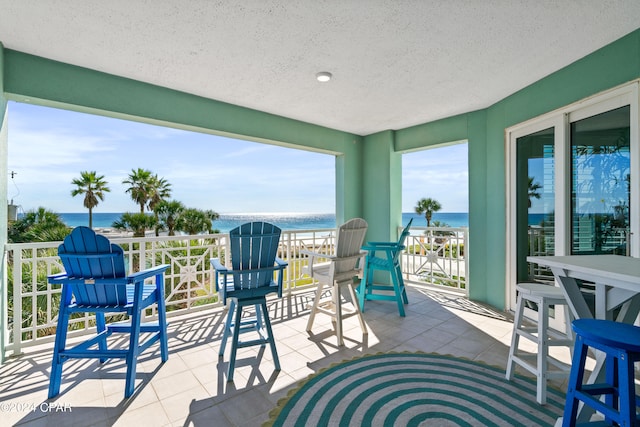 view of patio with a water view