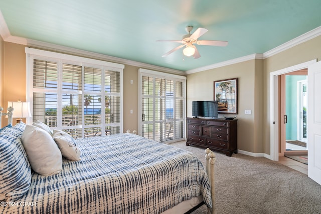 carpeted bedroom featuring ceiling fan and ornamental molding