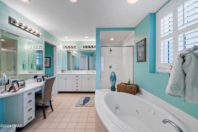 bathroom with shower with separate bathtub, vanity, and tile patterned floors