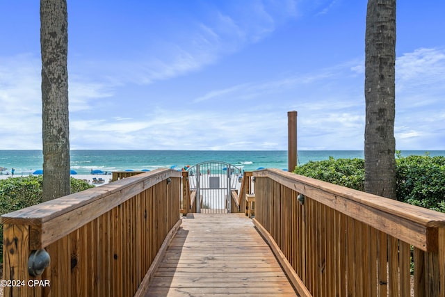 surrounding community featuring a view of the beach and a water view