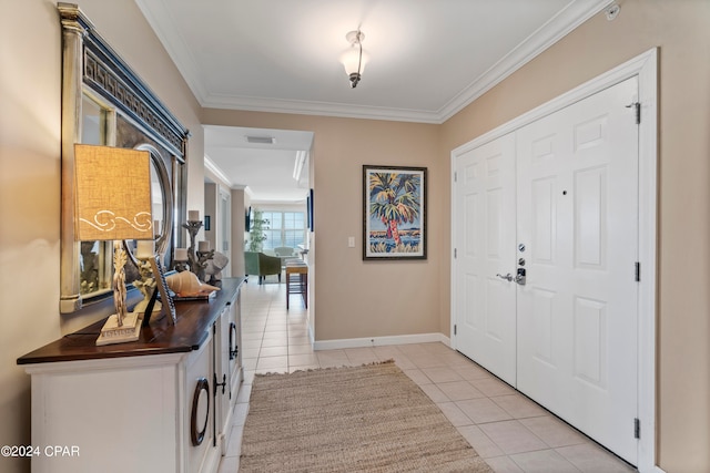 entrance foyer featuring light tile patterned floors and crown molding