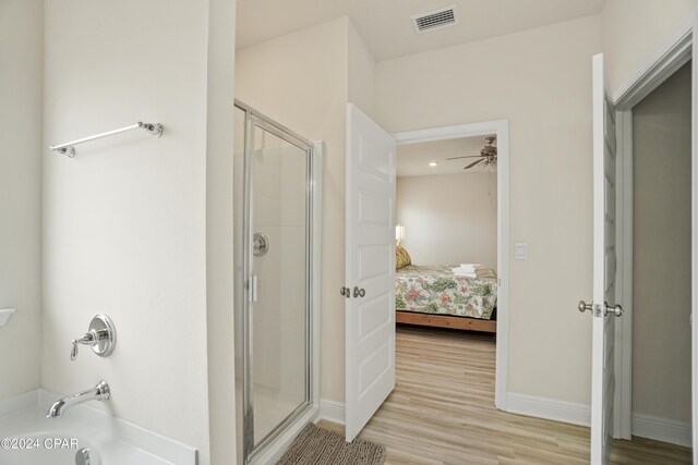 bedroom featuring hardwood / wood-style floors and ceiling fan