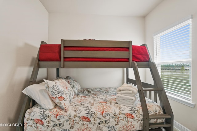 bedroom featuring baseboards