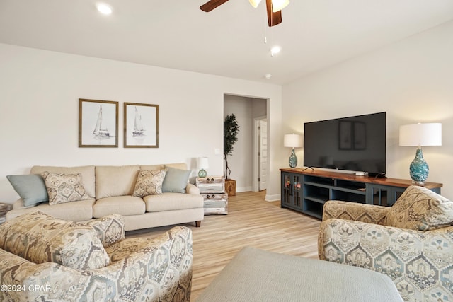 living area featuring light wood-style floors, recessed lighting, baseboards, and a ceiling fan