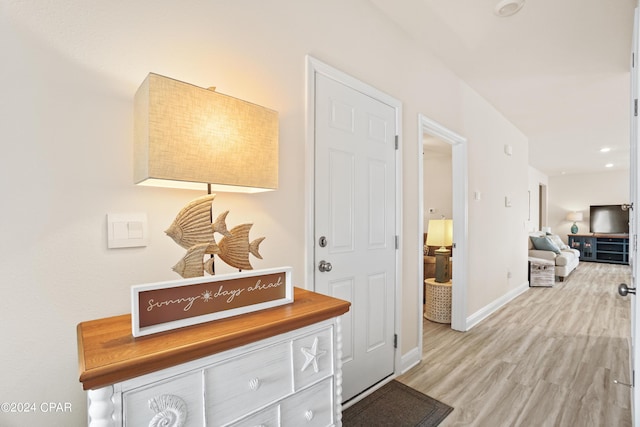 interior space featuring light wood-style floors and baseboards