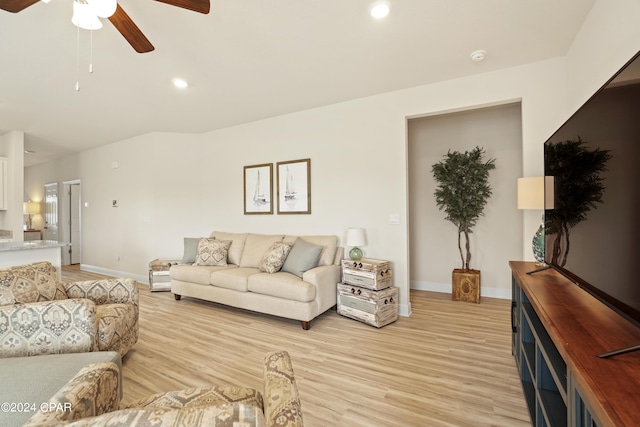 living room with light wood-style floors, ceiling fan, baseboards, and recessed lighting