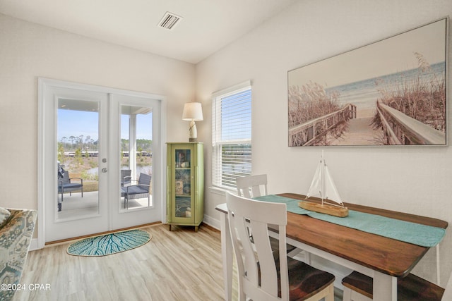 interior space featuring french doors and light hardwood / wood-style flooring