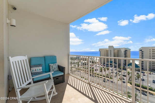 balcony featuring a water view