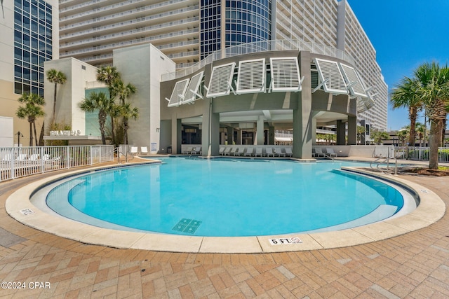 view of pool featuring a patio