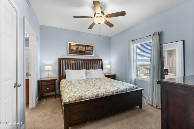 bedroom featuring light carpet and ceiling fan