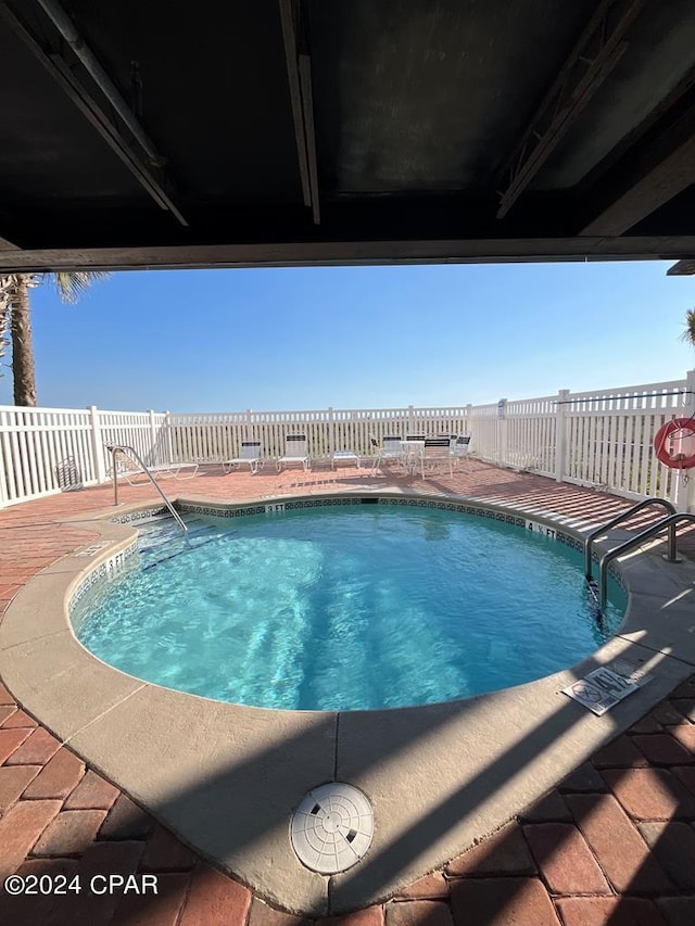 view of pool featuring a patio