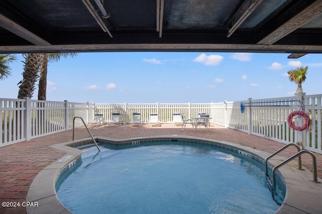 view of pool featuring a patio