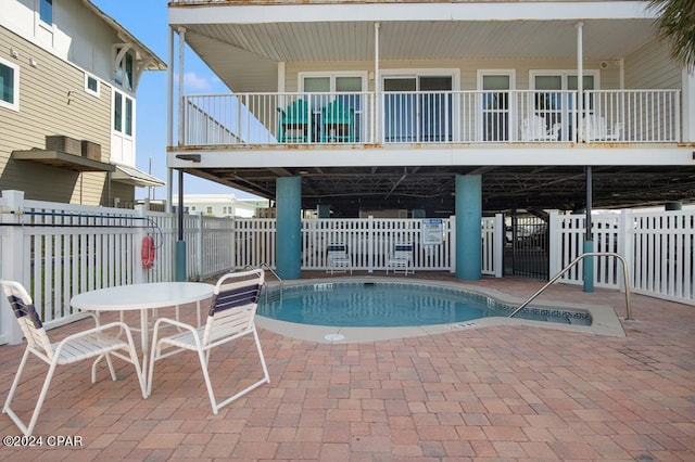 view of swimming pool featuring a patio