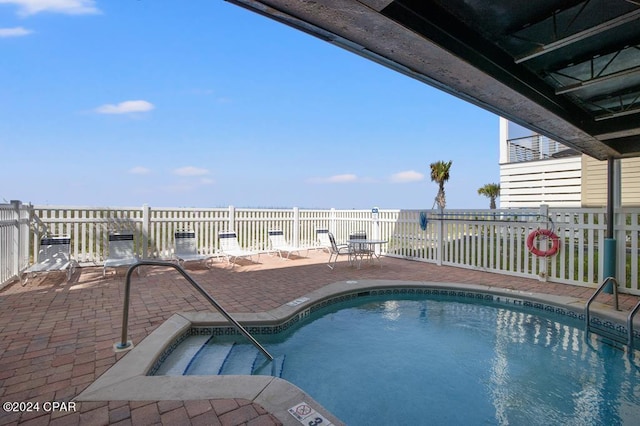 view of pool featuring a patio