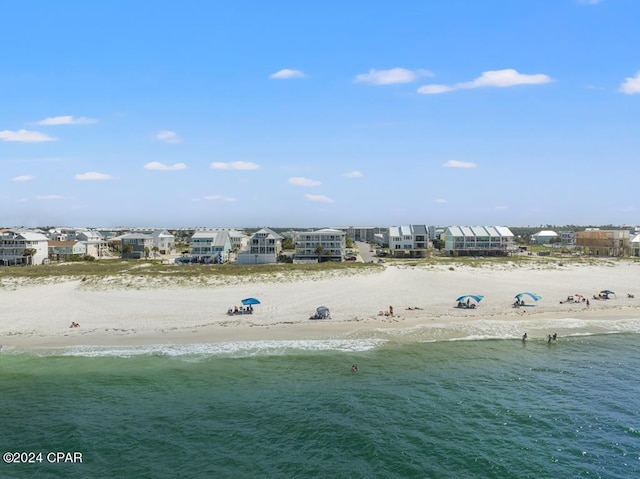 bird's eye view with a view of the beach and a water view